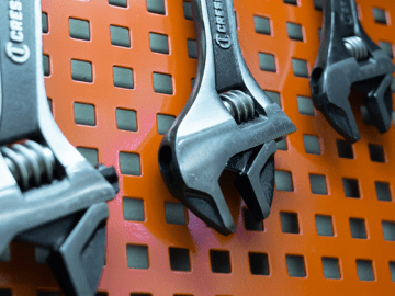 Crescent Wide Jaw Adjustable Wrenches hanging on peg board